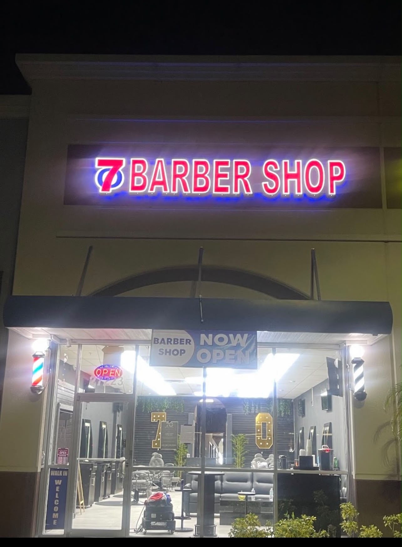 7Oaks Barbershop storefront at night